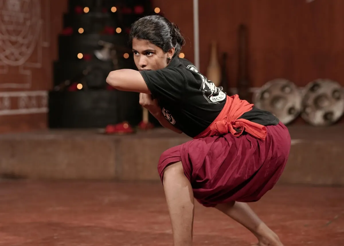 A student holding a low Kalaripayattu stance